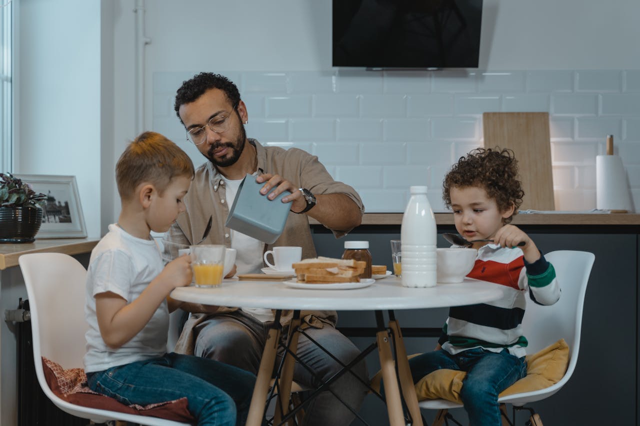 Father and children at dinner representing parenting arrangements and intervention order matter