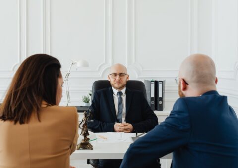 Lawyer reviewing a financial agreement with a high net worth couple
