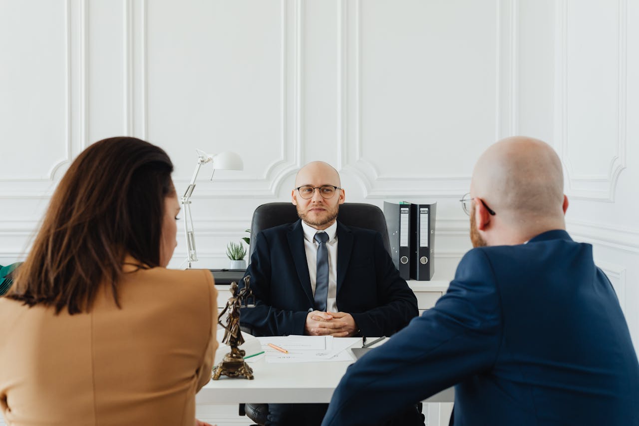 Lawyer reviewing a financial agreement with a high net worth couple