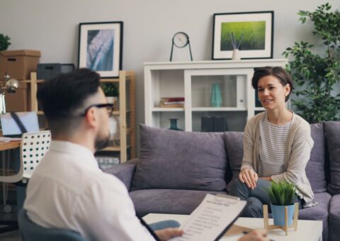 Lawyer discussing parenting and property issues with a client following intervention order proceedings