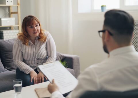 Lawyer discussing property settlement and business valuation with a client