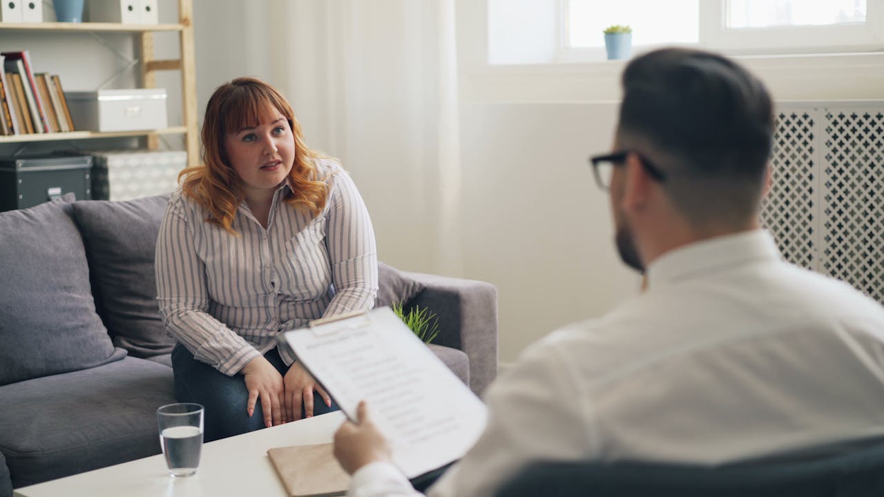 Lawyer discussing property settlement and business valuation with a client
